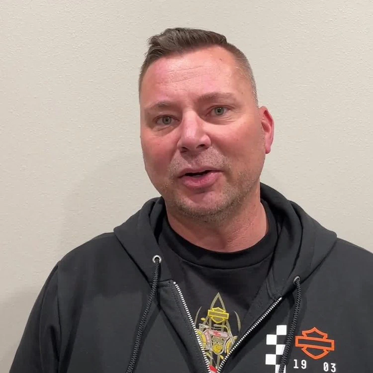Man in black hoodie sharing his healthcare experience and recovery journey