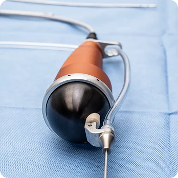 Laparoscopic surgical instrument with trocar and cannula on blue medical drape in operating room - in Brookfield and Appleton, WI.