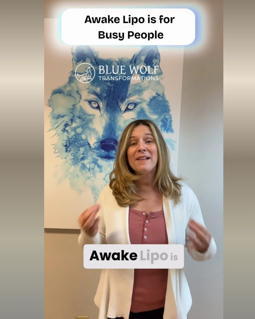 Woman holding Awake Lipo sign in front of Blue Wolf marketing poster promoting service for busy people