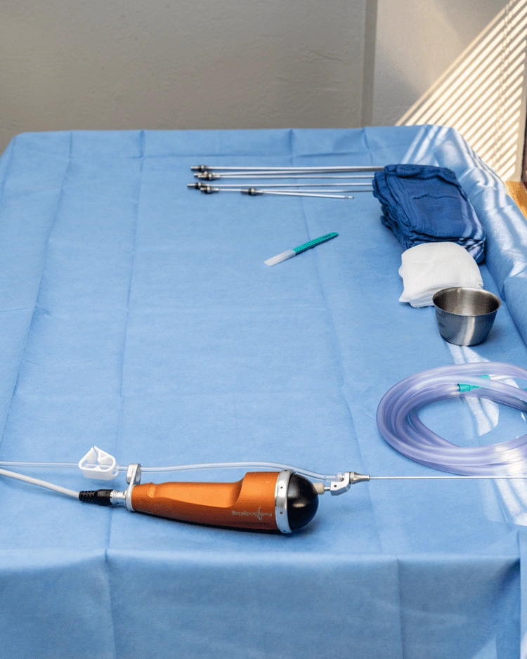 Laparoscopic surgical instruments and tools arranged on blue sterile drape for minimally invasive procedure - In Appleton, Brookfield, Milwaukee, WI & Gurnee, IL