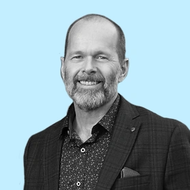 Dr. Mason portrait with light blue background